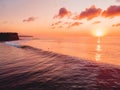 Aerial view of ocean with waves, surfers and sunset Royalty Free Stock Photo