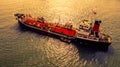 Aerial view oil and gas chemical tanker in open sea at sunset, Refinery Industry cargo ship Royalty Free Stock Photo