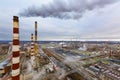 Aerial view of oil and gas industry - refinery in cloudy day - factory - petrochemical plant and a lot of chimneys with smoke and Royalty Free Stock Photo