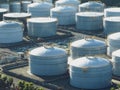 Aerial view of Oil Refinery Industrial Site and White Holding Container Tanks Royalty Free Stock Photo