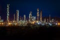 Aerial view oil refinery night with mountain background during t