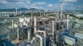 Aerial view oil refinery plant from industry zone, Oil and gas petrochemical industrial, Refinery factory oil storage tank and pip Royalty Free Stock Photo