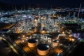 Aerial view oil storage tank with oil refinery factory industrial. Oil refinery plant at night. industry factory concept and Royalty Free Stock Photo