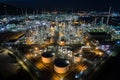 Aerial view oil storage tank with oil refinery factory industrial. Oil refinery plant at night. industry factory concept and Royalty Free Stock Photo