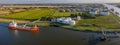 Aerial view of oil tankers moored at an oil storage silo terminal of chemical plant.Drone view of industrial complex with gas, oil Royalty Free Stock Photo