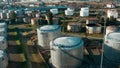 Aerial view of oil tanks at oil refinery. Gas and oil steel storage tanks. Petrol industrial plant