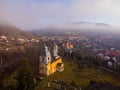 Aerial view of an old and abandoned church in a foggy day Royalty Free Stock Photo
