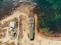 Aerial view of old abandoned rusted ship aground after shipwreck accident in Crimean coast on sand beach Royalty Free Stock Photo