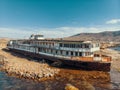 Aerial view of old abandoned rusted ship aground after shipwreck accident in Crimean coast on sand beach Royalty Free Stock Photo