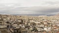 Aerial view of old Cappadocia Park in Turkey. Action. Stone houses and buildings surrounded by rocks on cloudy sky Royalty Free Stock Photo