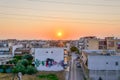 Aerial View of Old City During Sunset. Roads, Buildings, Rooftops and Sea While the Sun Goes Down at Evening Time