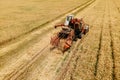 aerial view of a old Combine harvester goes on way to harvest wheat. Royalty Free Stock Photo