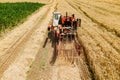 aerial view of a old Combine harvester goes on way to harvest wheat. Royalty Free Stock Photo