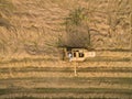 Aerial view of a old combine harvester at the grain harvest Royalty Free Stock Photo