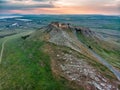 Aerial view of the old Enisala stronghold citadel standing on the hill in the sunset