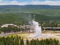 Aerial view of the Old Faithful geyser hot water eruptions