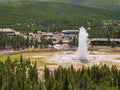 Aerial view of the Old Faithful geyser hot water eruptions