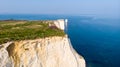 An aerial view of the Old Harry Rocks along the Jurassic coast with crystal clear water and white cliffs under a hazy sky Royalty Free Stock Photo