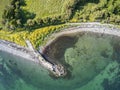 Aerial view of an old pier in a rocky beach in Galway bay Royalty Free Stock Photo