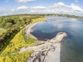 Aerial view of an old pier in a rocky beach in Galway bay Royalty Free Stock Photo