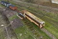 Aerial view on old, rusted and abandoned passenger wagon standing on sidetrack Royalty Free Stock Photo