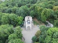 Aerial view of old stony building surrounded by dense trees in London Royalty Free Stock Photo