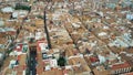 Aerial view of old tiled sloping roofs and narrow streets in Granada centre, Spain Royalty Free Stock Photo