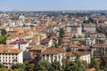 Aerial view of the old town Bergamo in northern Italy with red tiled roofs of houses on the background of the Alpine mountains. Royalty Free Stock Photo