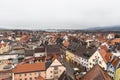 Aerial view of the old town of Fussen on a cloudy winter day from the Hohes Schloss castle, with the Forggensee lake in background