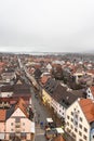 Aerial view of the old town of Fussen on a cloudy winter day from the Hohes Schloss castle, with the Forggensee lake in background