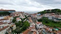 Aerial view of the old town's red rooftops and lush greenery in Lisbon, Portugal Royalty Free Stock Photo