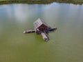 Aerial view of old wooden fisherman house on the lake. Beautiful landscape with house on the lake Royalty Free Stock Photo