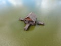 Aerial view of old wooden fisherman house on the lake. Beautiful landscape with house on the lake Royalty Free Stock Photo