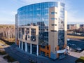 Aerial View of one entrance to bulding with offices and parking cars in the city Royalty Free Stock Photo