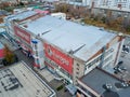 Aerial View of one entrance to bulding with offices and parking cars in the city Royalty Free Stock Photo