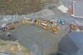 Aerial view of open cast mining panorama quarry with lots of machinery at work equipment at a plant