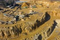 Aerial view of opencast mining quarry with lots of machinery. Industrial place view from above. Photo captured with drone Royalty Free Stock Photo