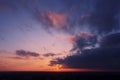Aerial view of an orange or pink sky, a beautiful sunset, the clouds are highlighted with bright light.Evening time Royalty Free Stock Photo
