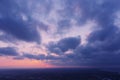 Aerial view of an orange or pink sky, a beautiful sunset, the clouds are highlighted with bright light.Evening time Royalty Free Stock Photo