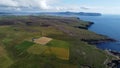 Aerial view of Orkney Islands coastline and fields Royalty Free Stock Photo
