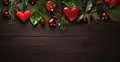 Aerial view of ornaments of green spruce leaves red hearts on wooden top.Valentine\'s Day banner with space for your own con Royalty Free Stock Photo