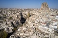 Aerial view of Ortahisar town old houses in rock formations.