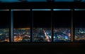 Aerial view of the Osaka skyline through a skyscraper window