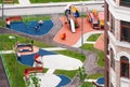 Aerial view outdoor children playground and house building exterior multi-family residential district area development Royalty Free Stock Photo