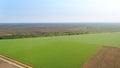 Aerial view over the agricultural fields spring time. Royalty Free Stock Photo