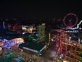 Aerial view over amusement park Wurstelprater in the dark in Vienna, Austria with illuminated rides including roller coasters. Royalty Free Stock Photo