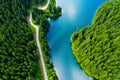 Aerial view over beautiful turquoise mountain lake and green forest. Spring in the mountains. Green forest, mountain lake. Green p Royalty Free Stock Photo