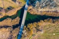Aerial view over bridge on the small river and the forest, spring Sunny day, Central Russia Royalty Free Stock Photo