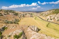 Aerial view over Dobrogei Gorges road and rock landscape - amazing landmark with blue sky and white clouds