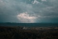 Aerial view over the green forest in evening. Cloudy mystery. Landscapes of Latvia. Royalty Free Stock Photo